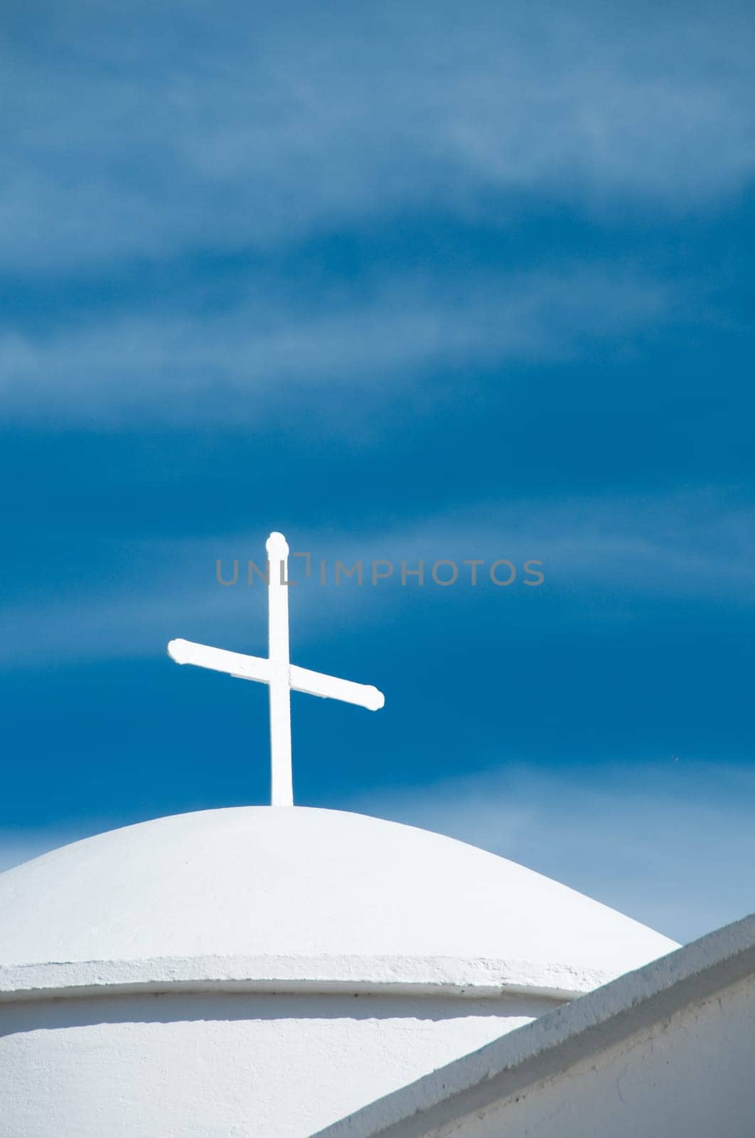 Greek church in santorini greece with a cross