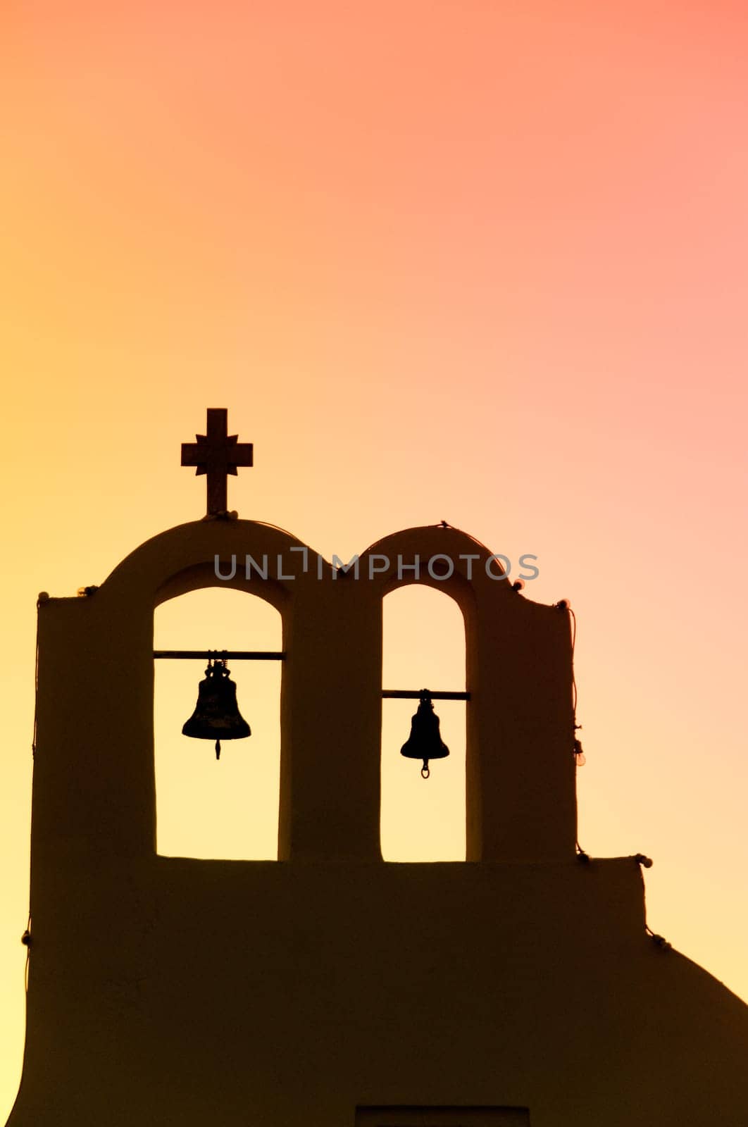 Greek church in santorini greece with a cross