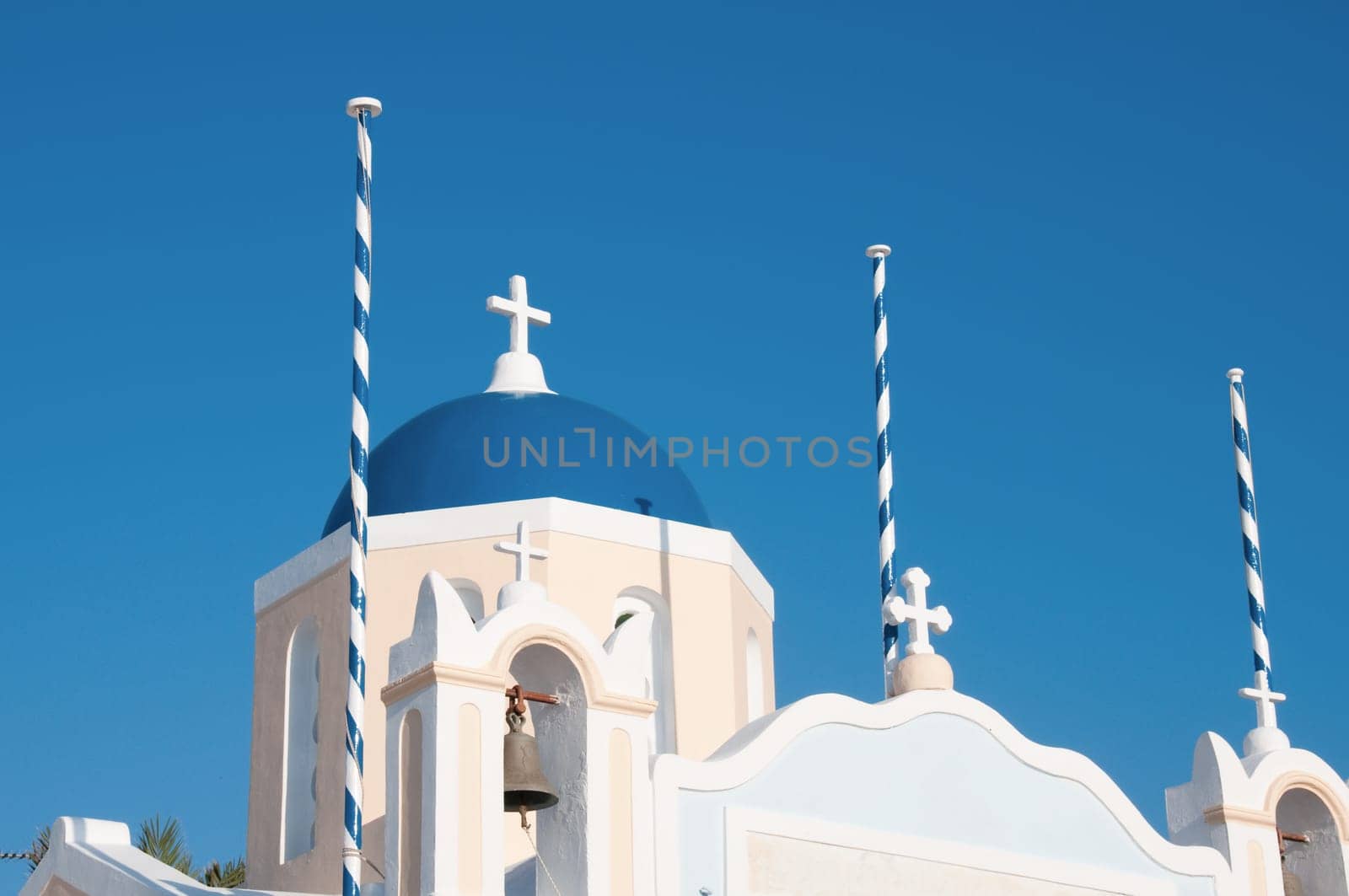 Greek church in santorini greece with a cross