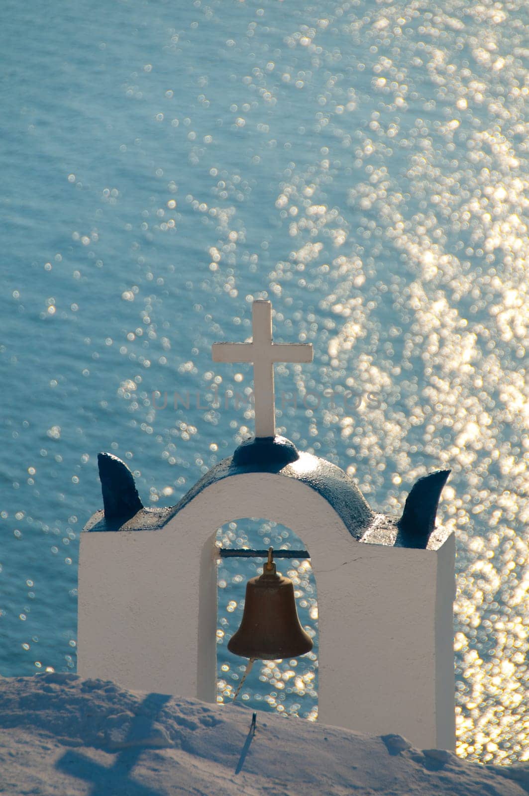 Greek church in santorini greece with a cross