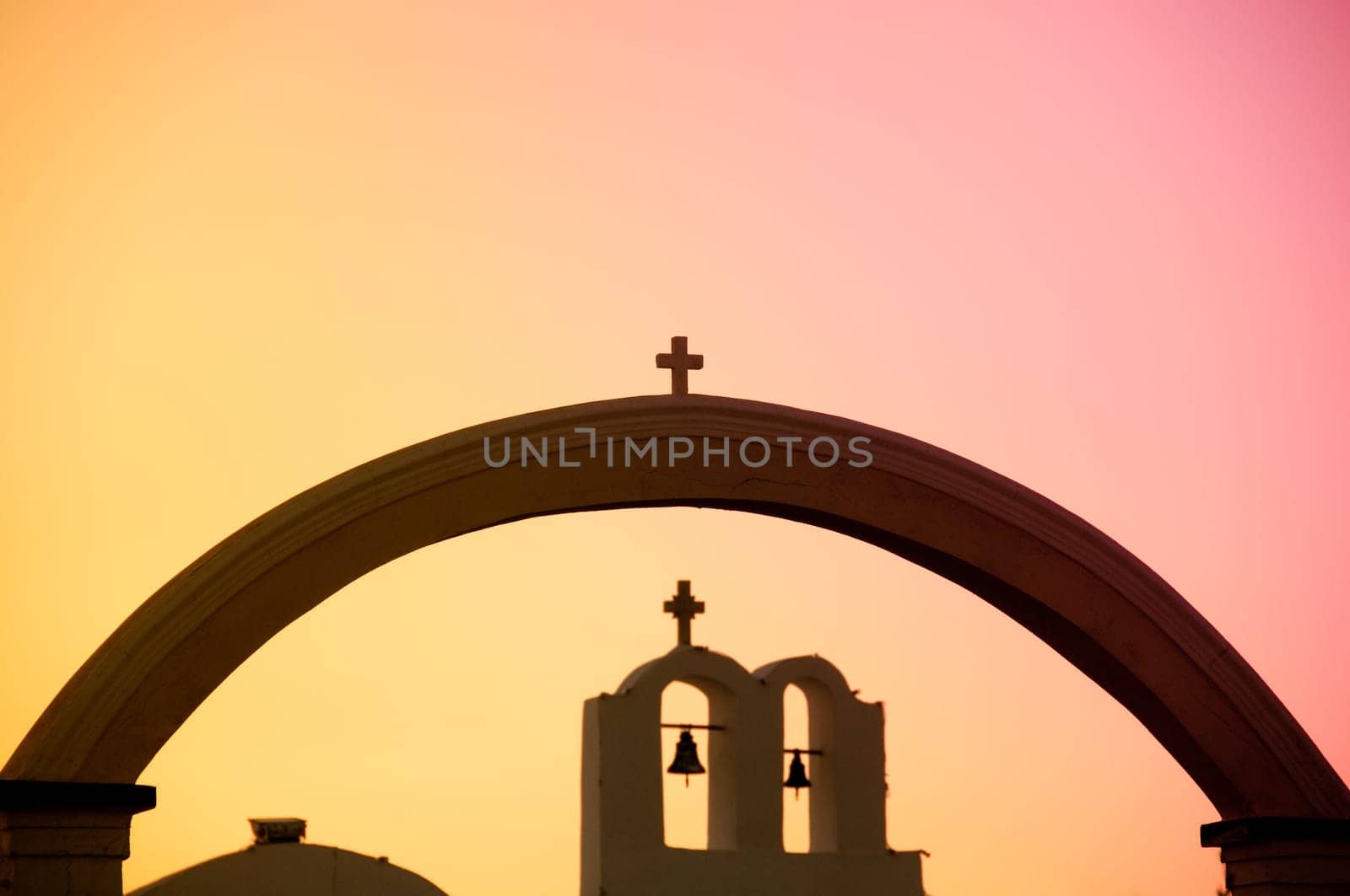 Greek church in santorini greece with a cross