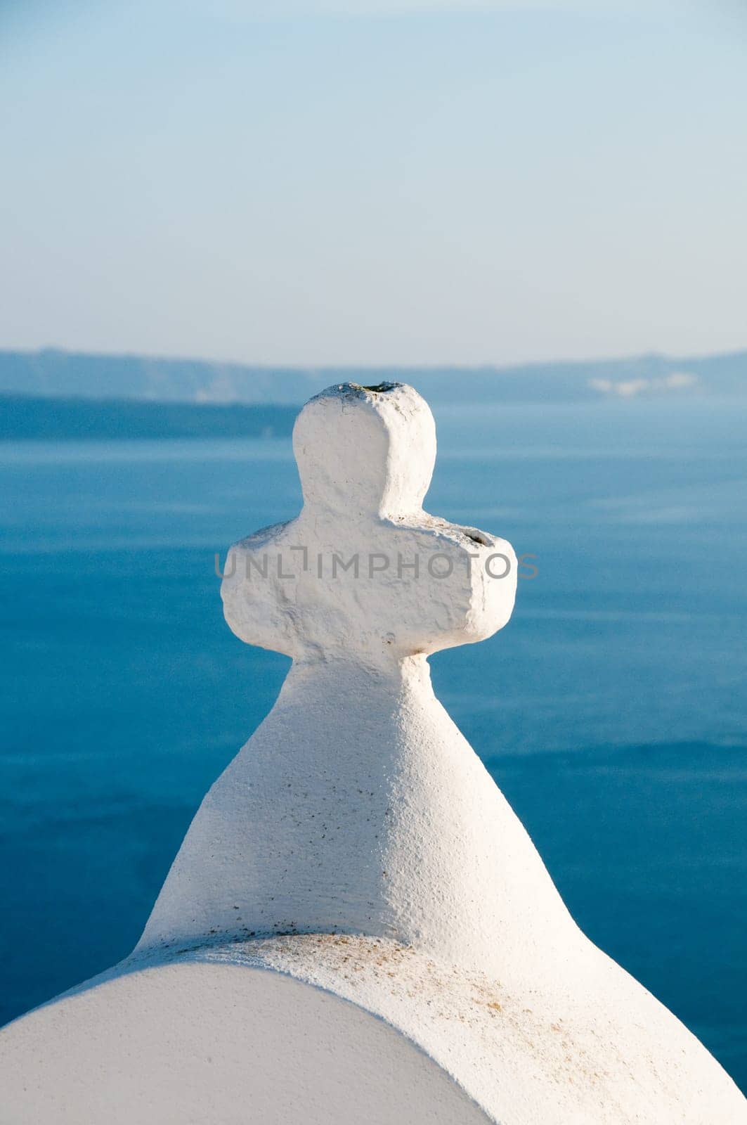 Greek church in santorini greece with a cross