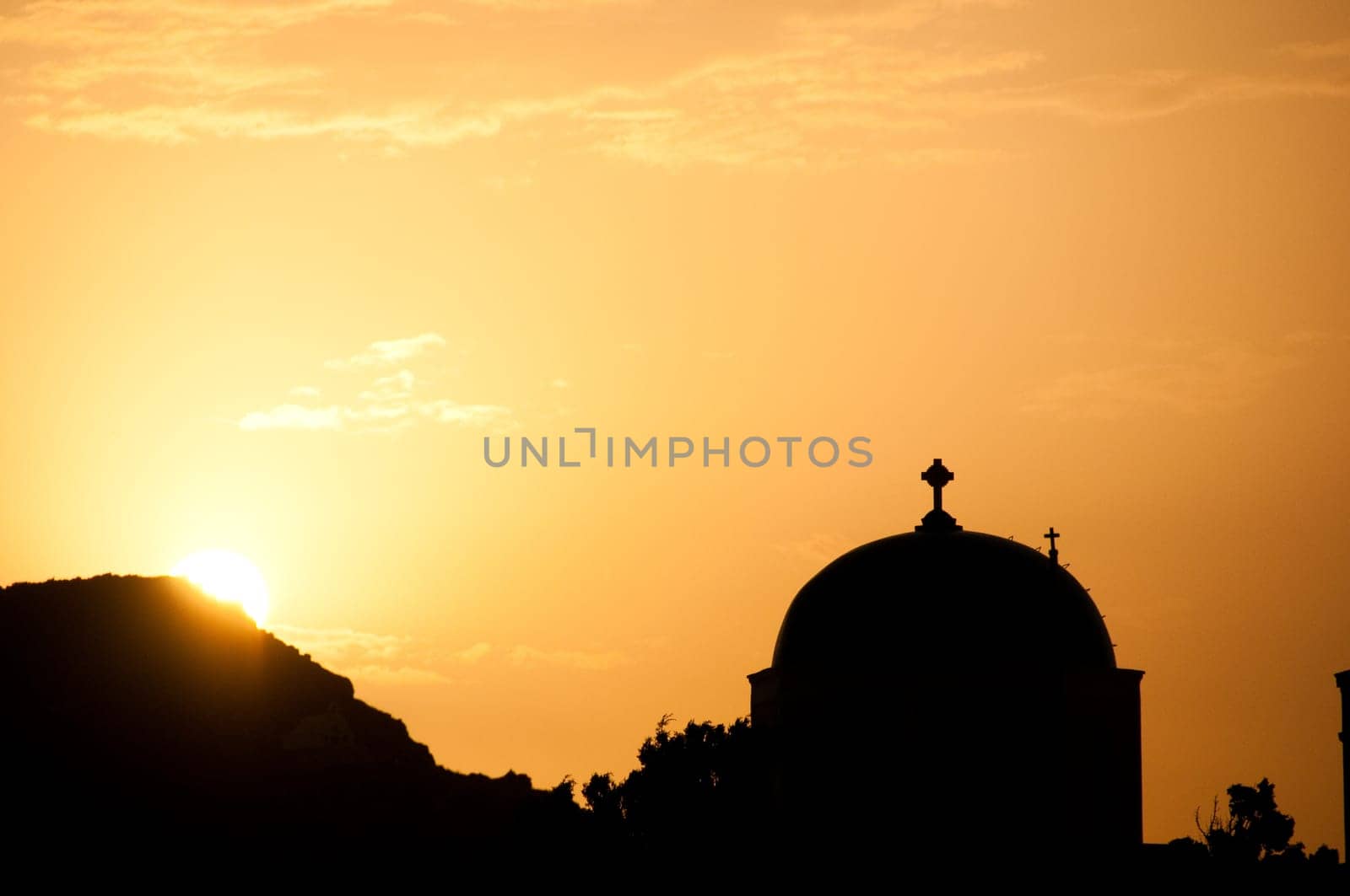 Greek church in santorini greece with a cross