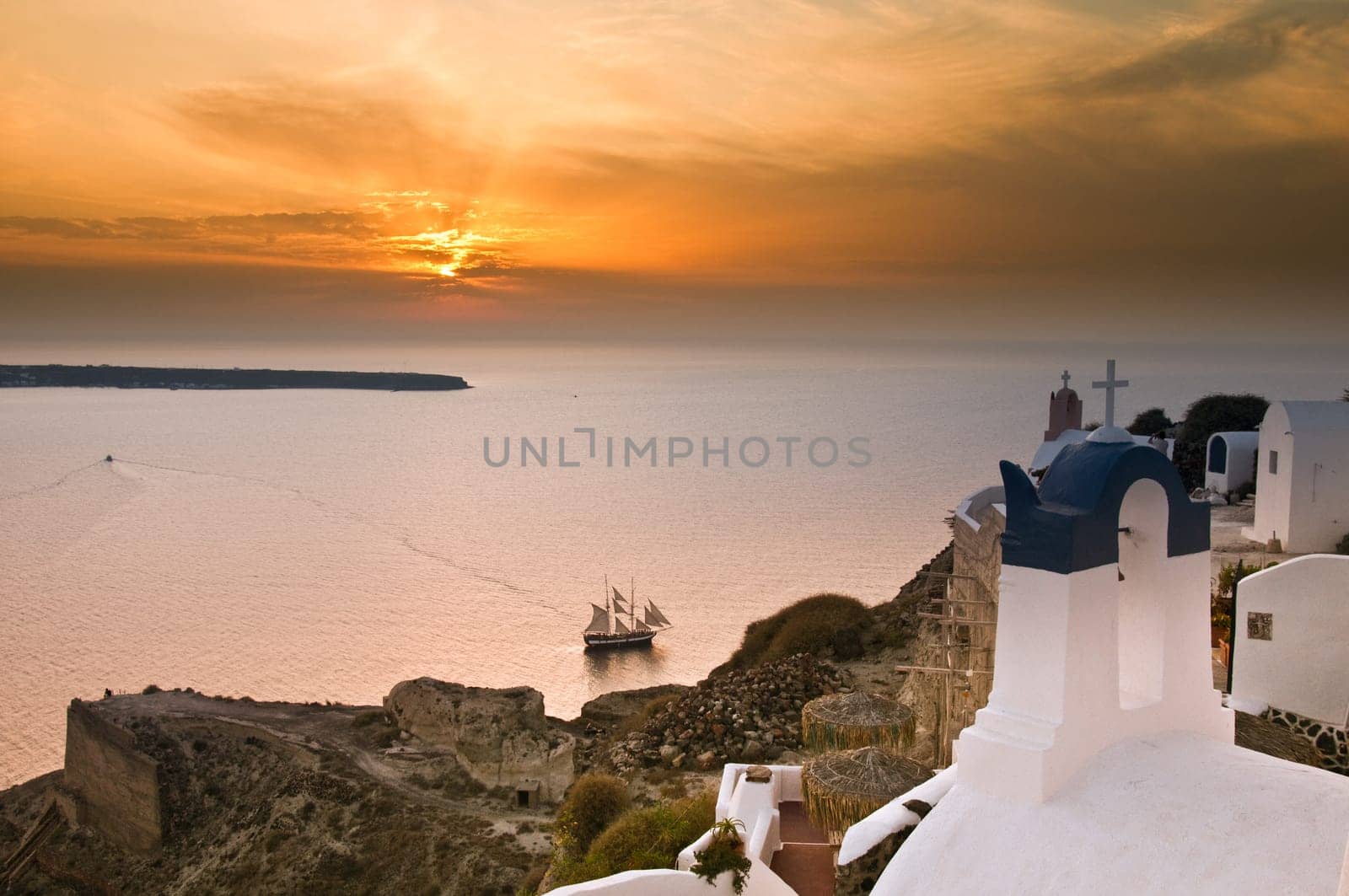 Greek church in santorini greece with a cross