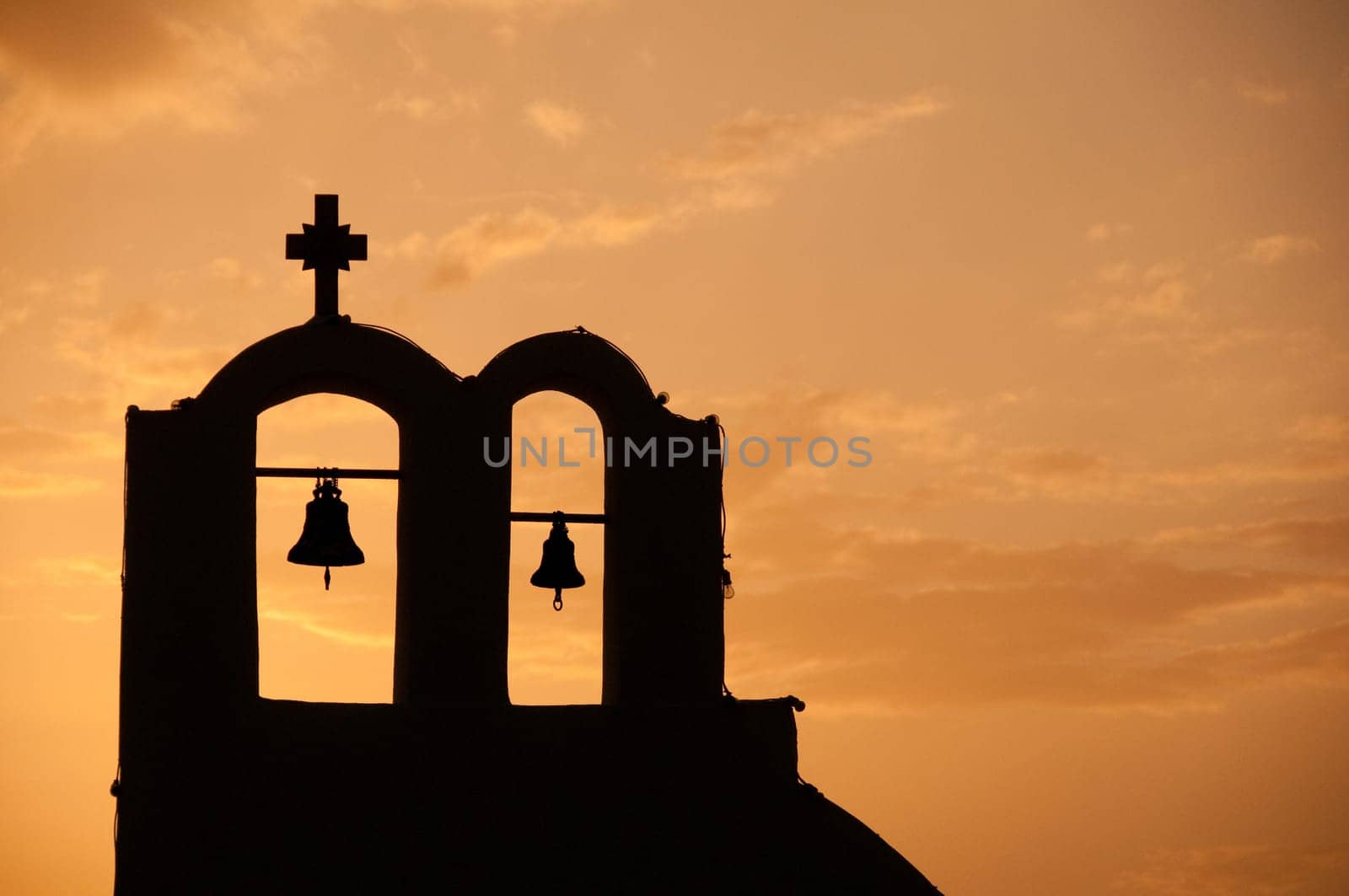 Greek church in santorini greece with a cross
