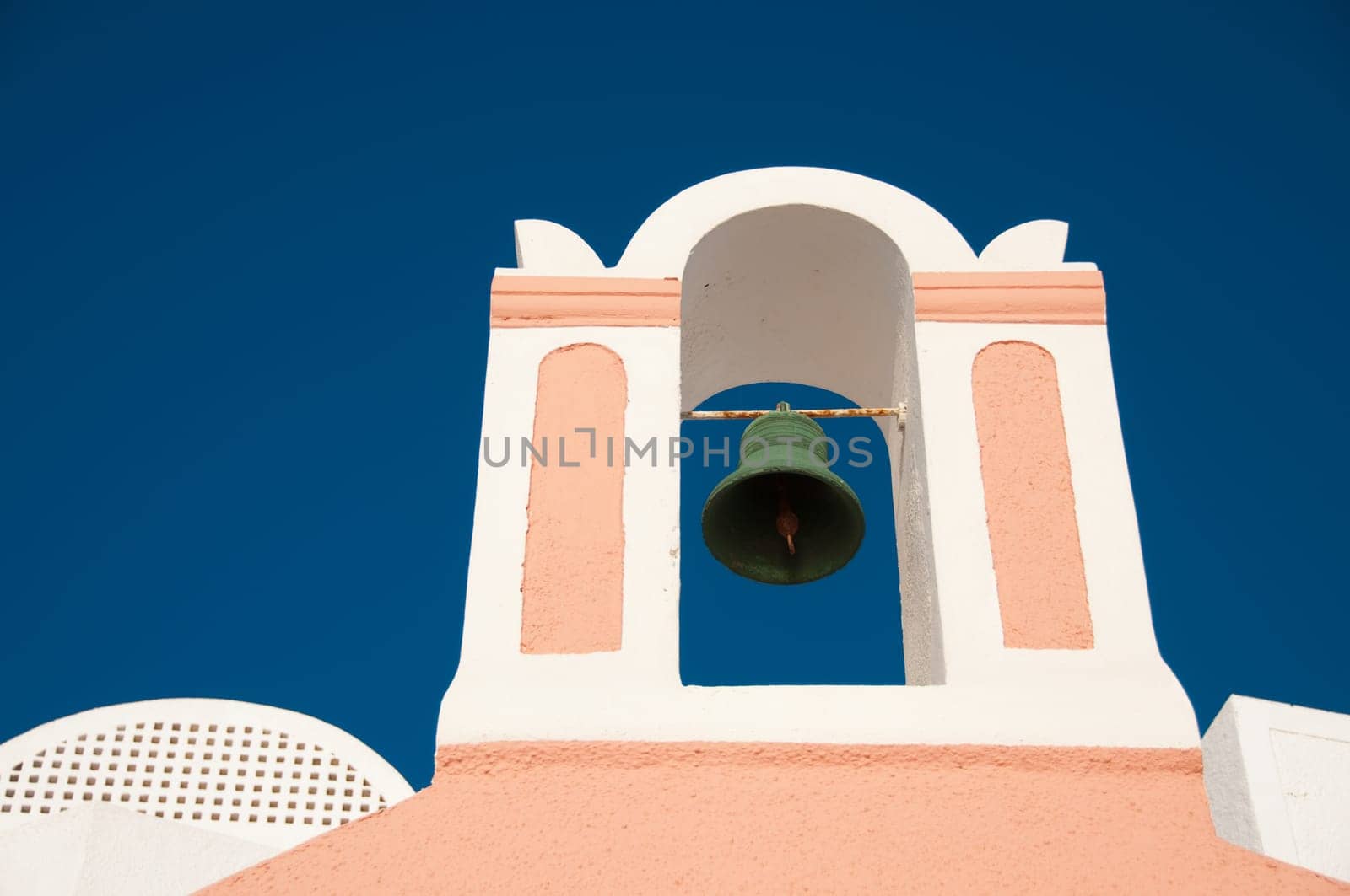 Greek church in santorini greece with a cross