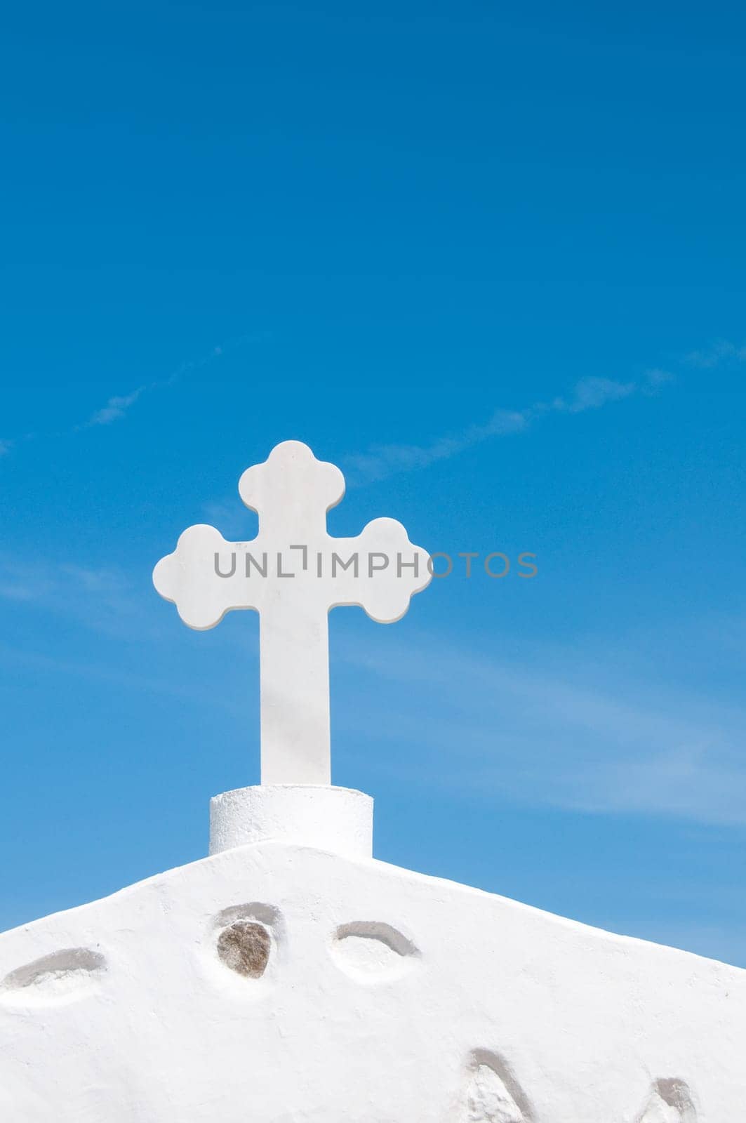 Greek church in santorini greece with a cross