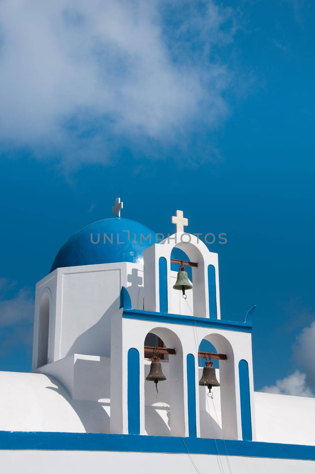 Greek church in santorini greece with a cross