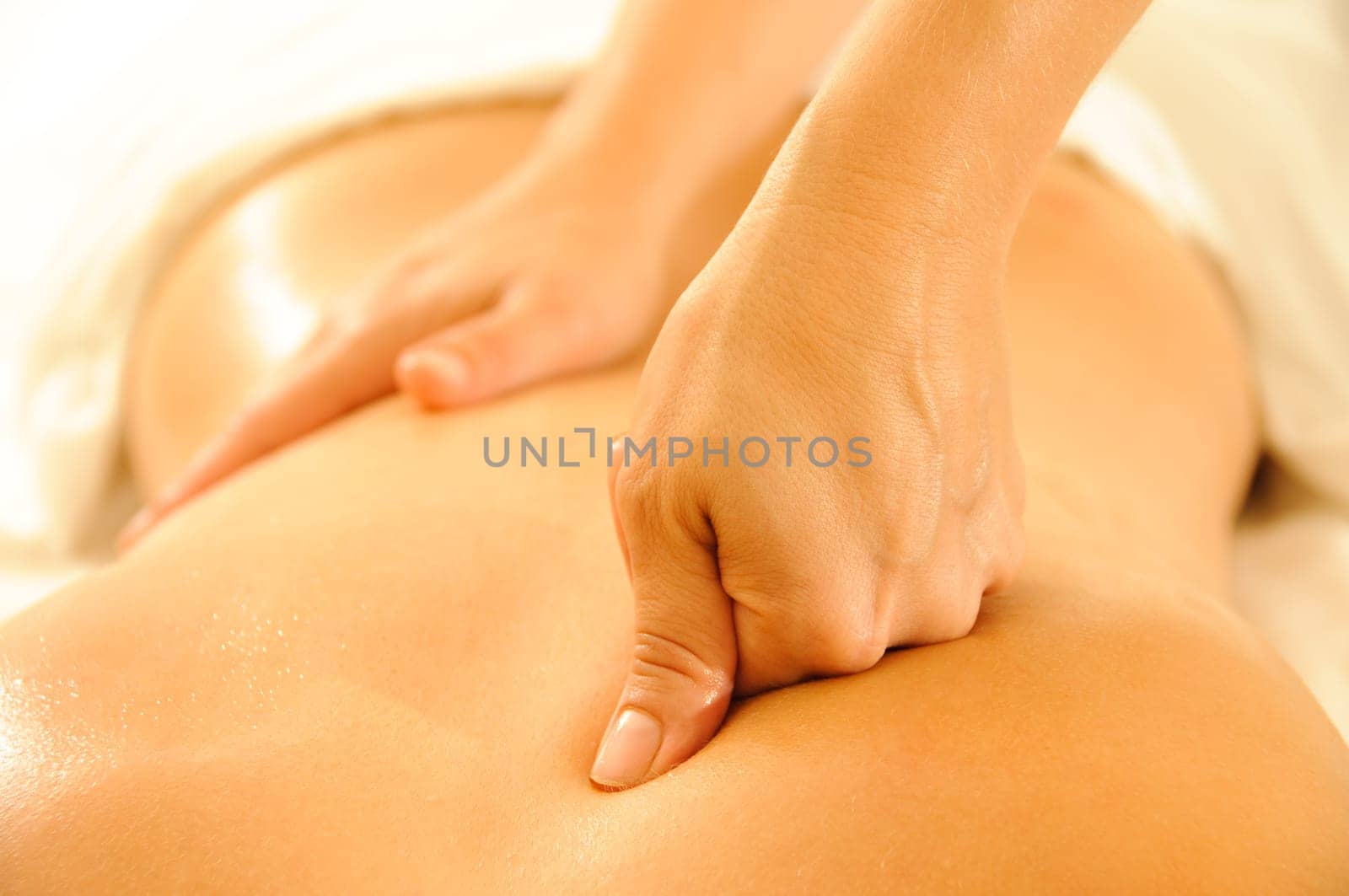 Beautiful woman in a spa with massage therapy