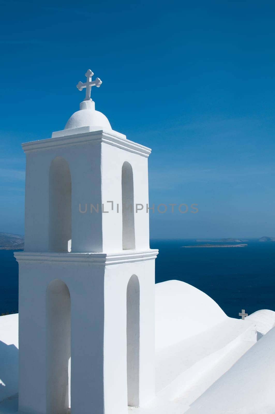 Greek church in santorini greece with a cross