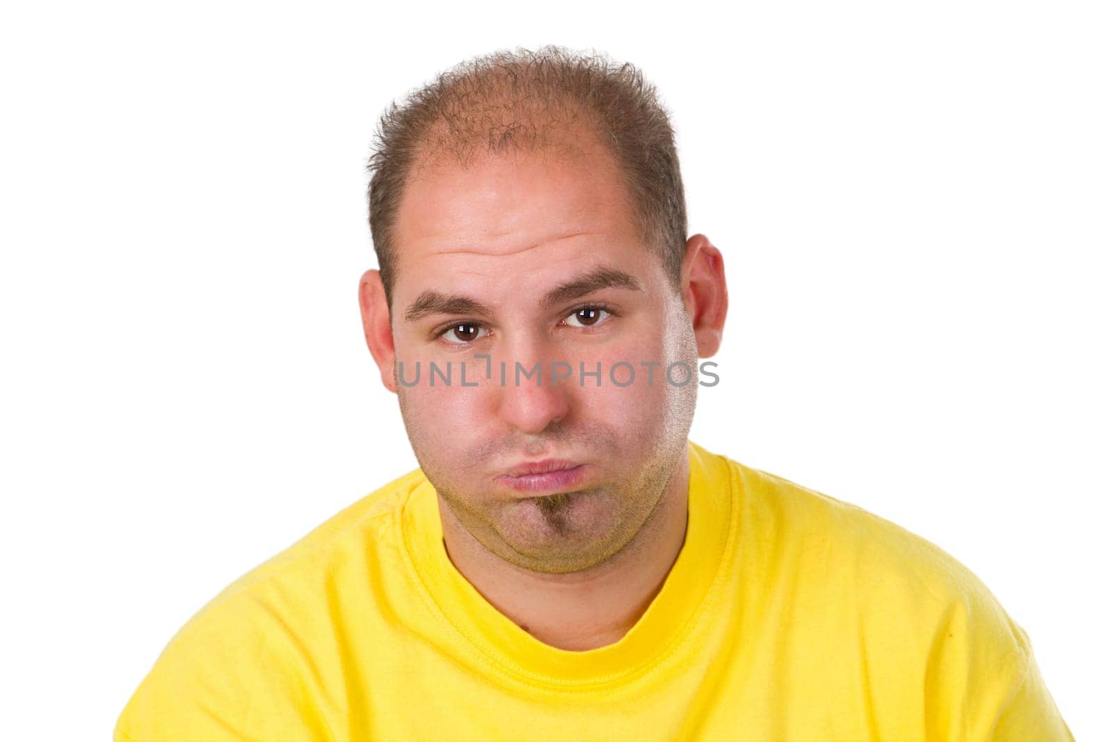 Young man presses lips together - isolated on white background