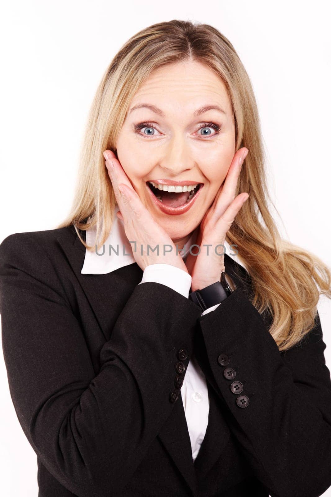 Portrait of amazed businesswoman touching her face