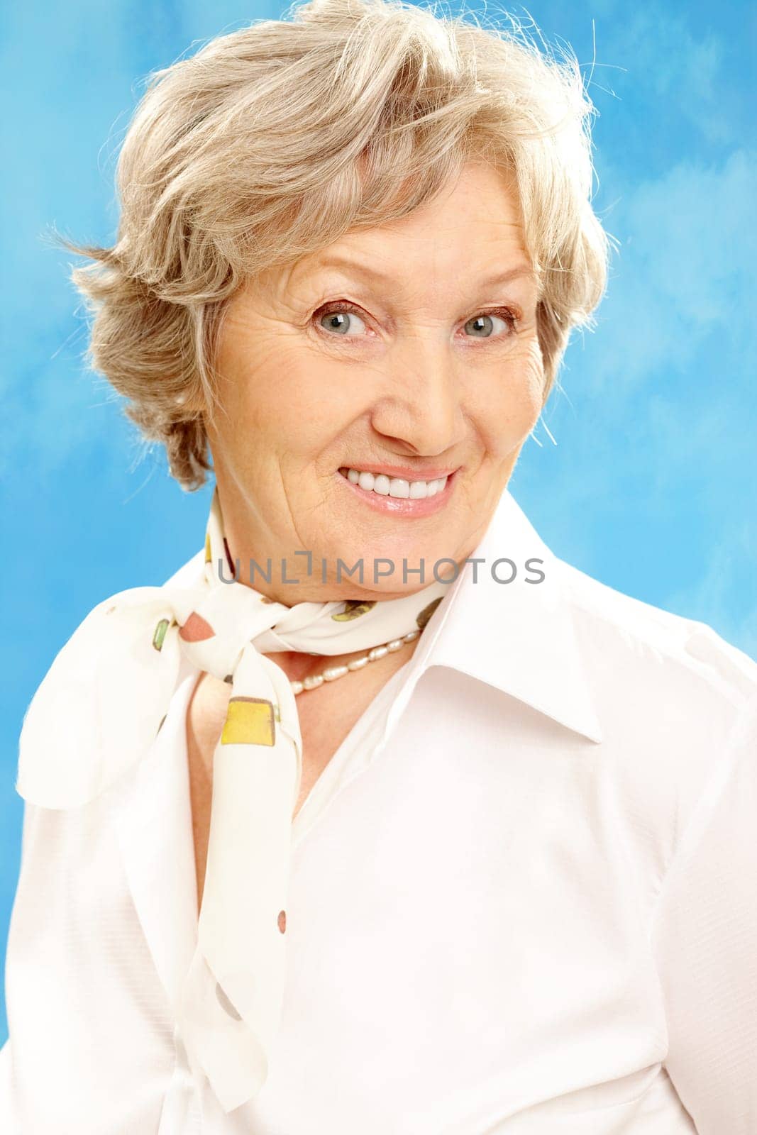 Portrait of grey haired female looking at camera