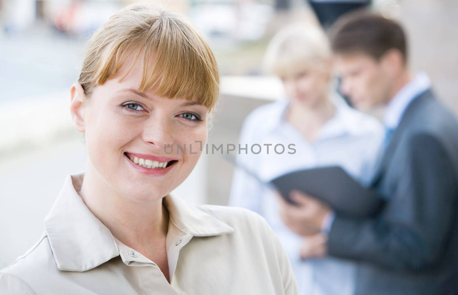 Portrait of successful female looking at camera with smile