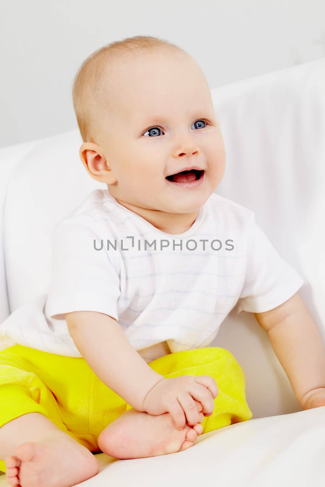 Vertical image of small girl looking aside