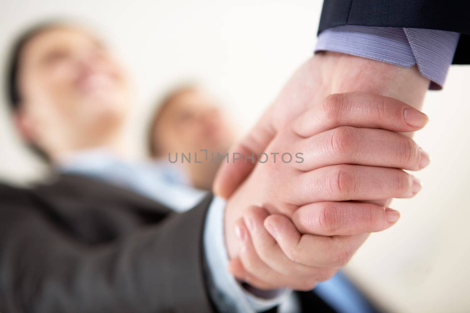 Close-up of business people sharing hands