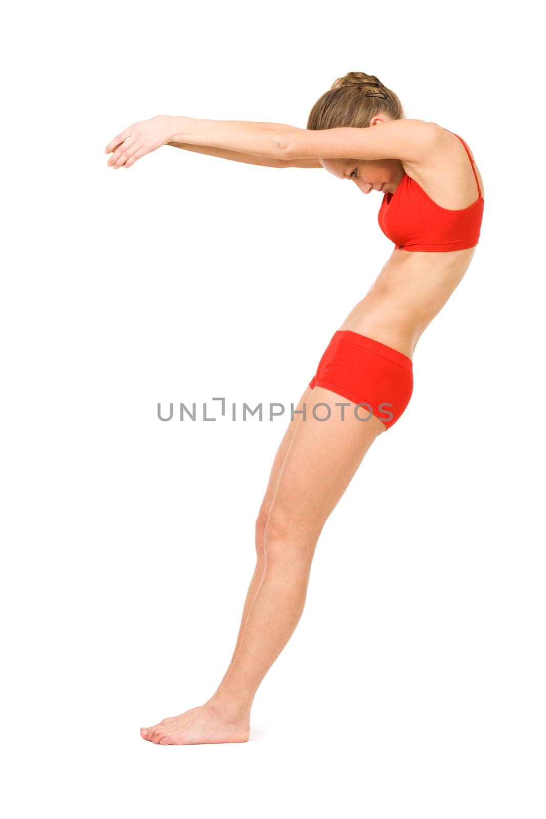Image of young girl practicing physical exercise forming number seven