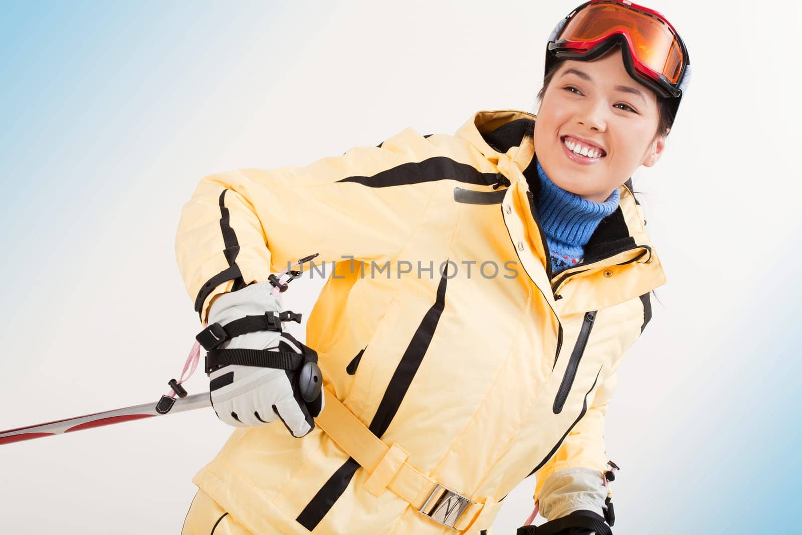 Portrait of happy sporty woman skiing