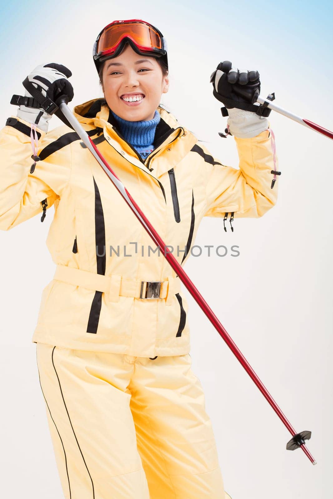 Portrait of sporty woman skiing