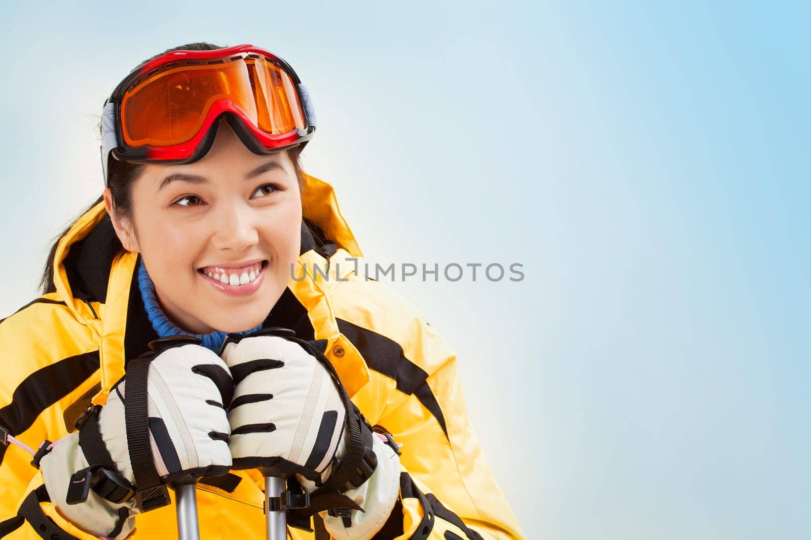 Portrait of smiling girl with sport glasses looking aside