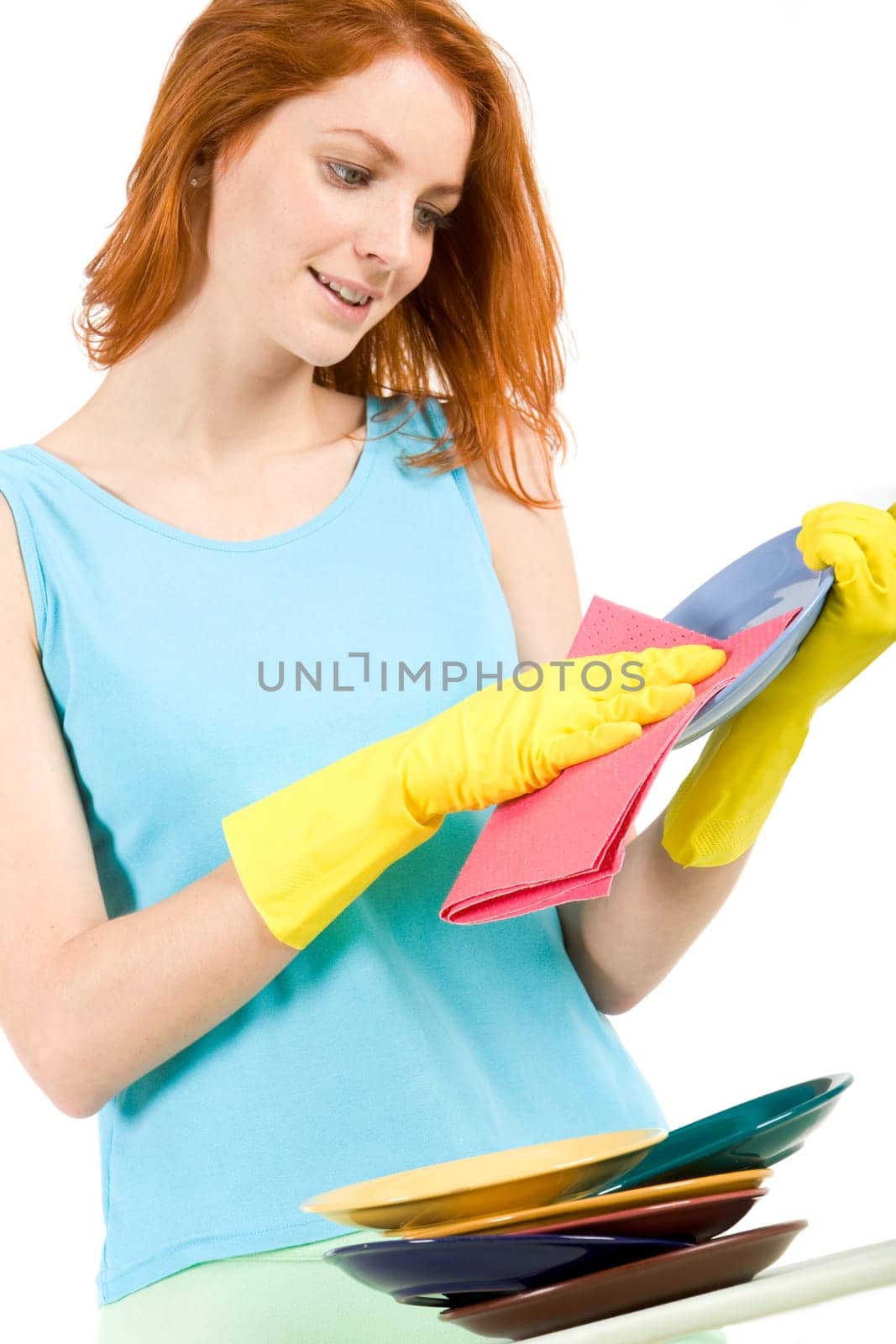 Portrait of young female holding plate and washing it