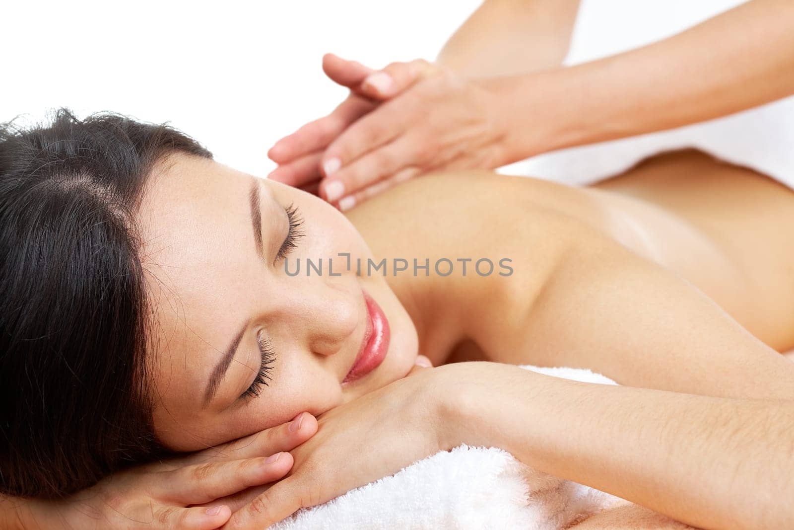 Portrait of young female enjoying the procedure of massage