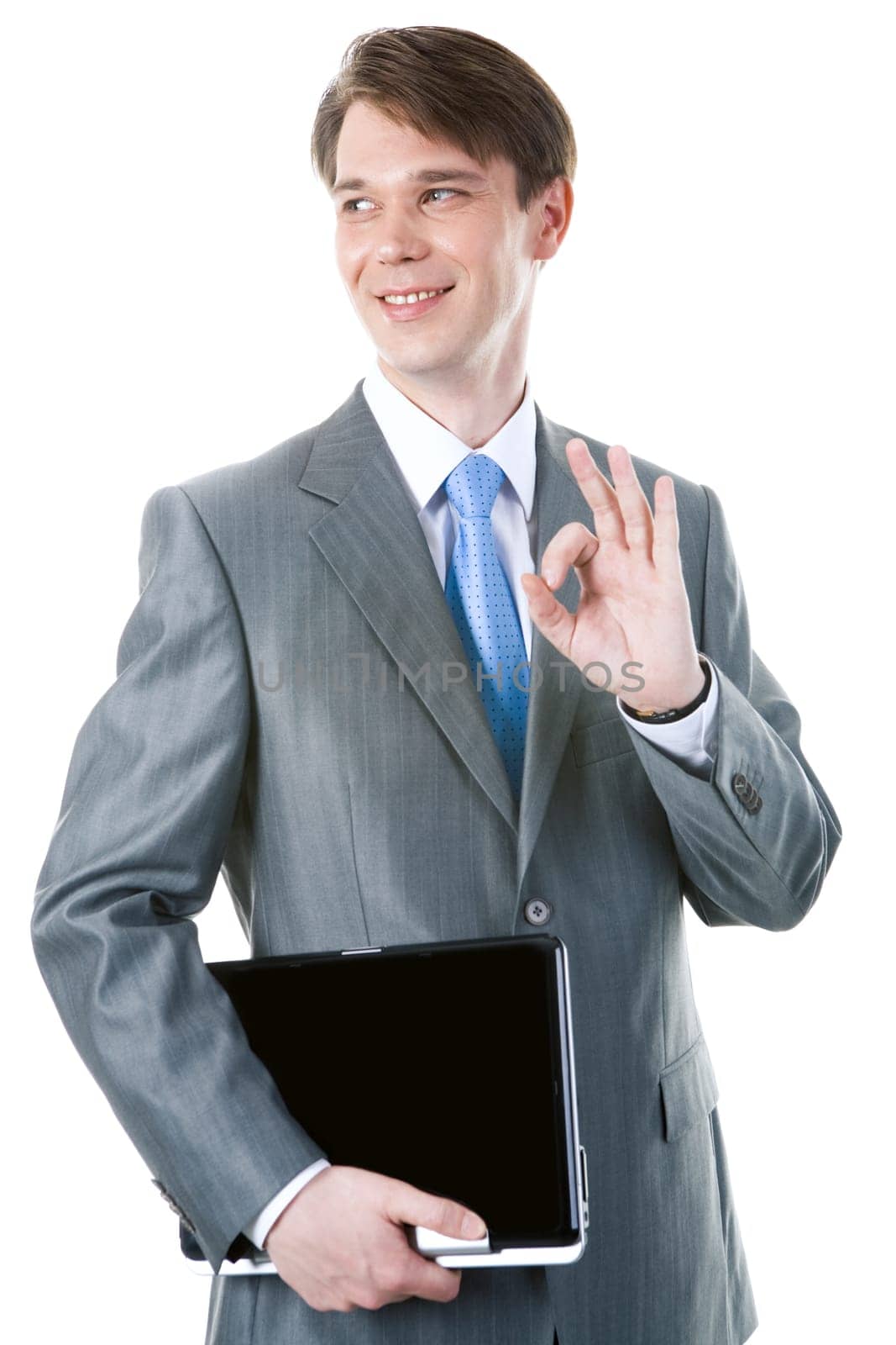 Portrait of happy businessman with laptop showing sign of okay