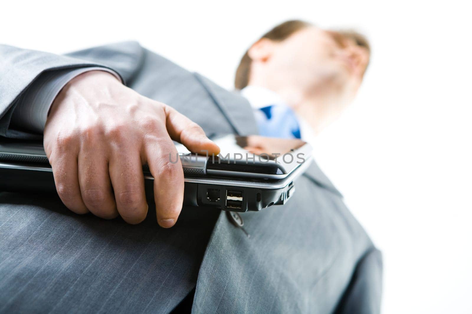 Close-up of businessman with the laptop on a white background