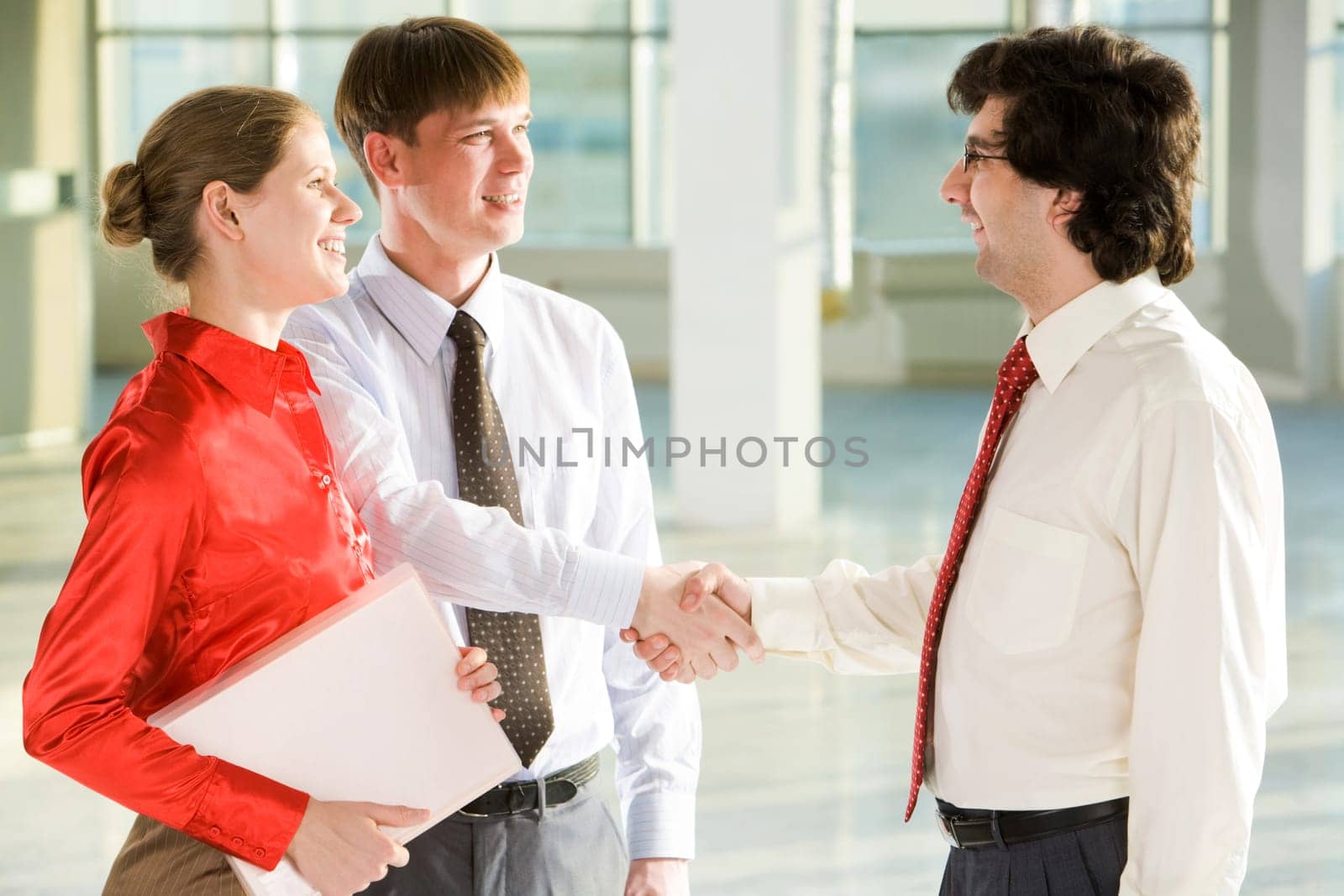 Business people shaking hands making an agreement at meeting
