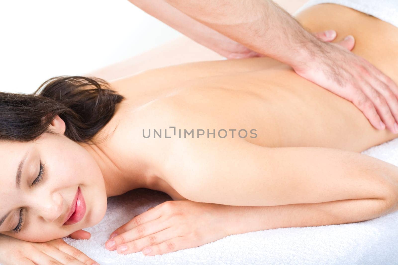 Portrait of smiling woman taking enjoyment from massage