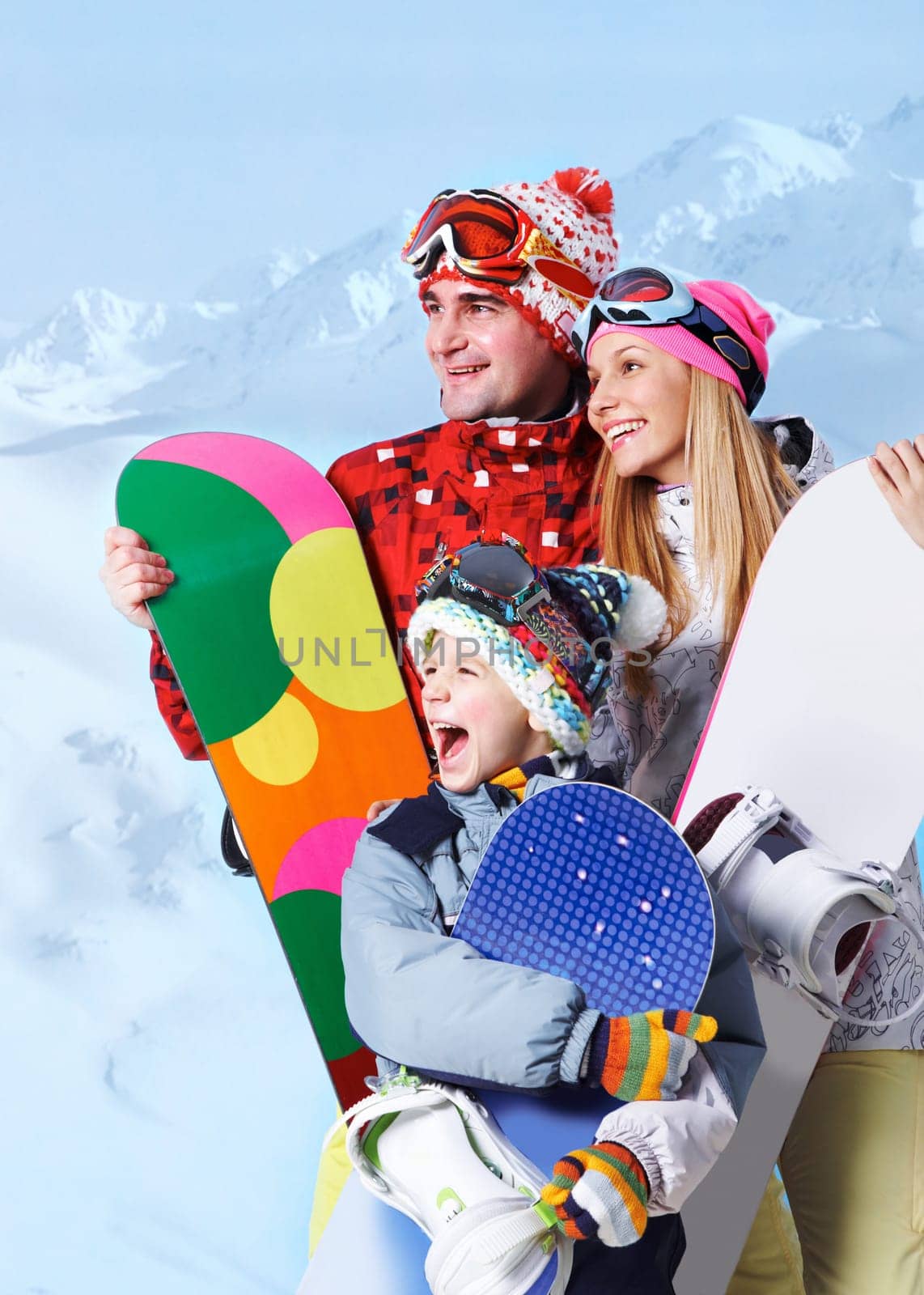 Portrait of happy family with snowboards on winter resort