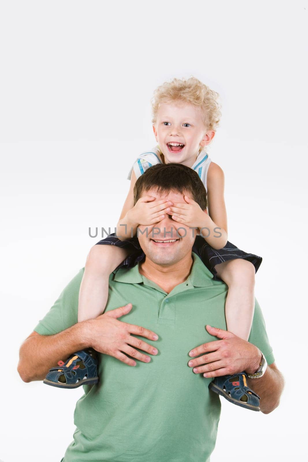Image of son putting his palms on father's face