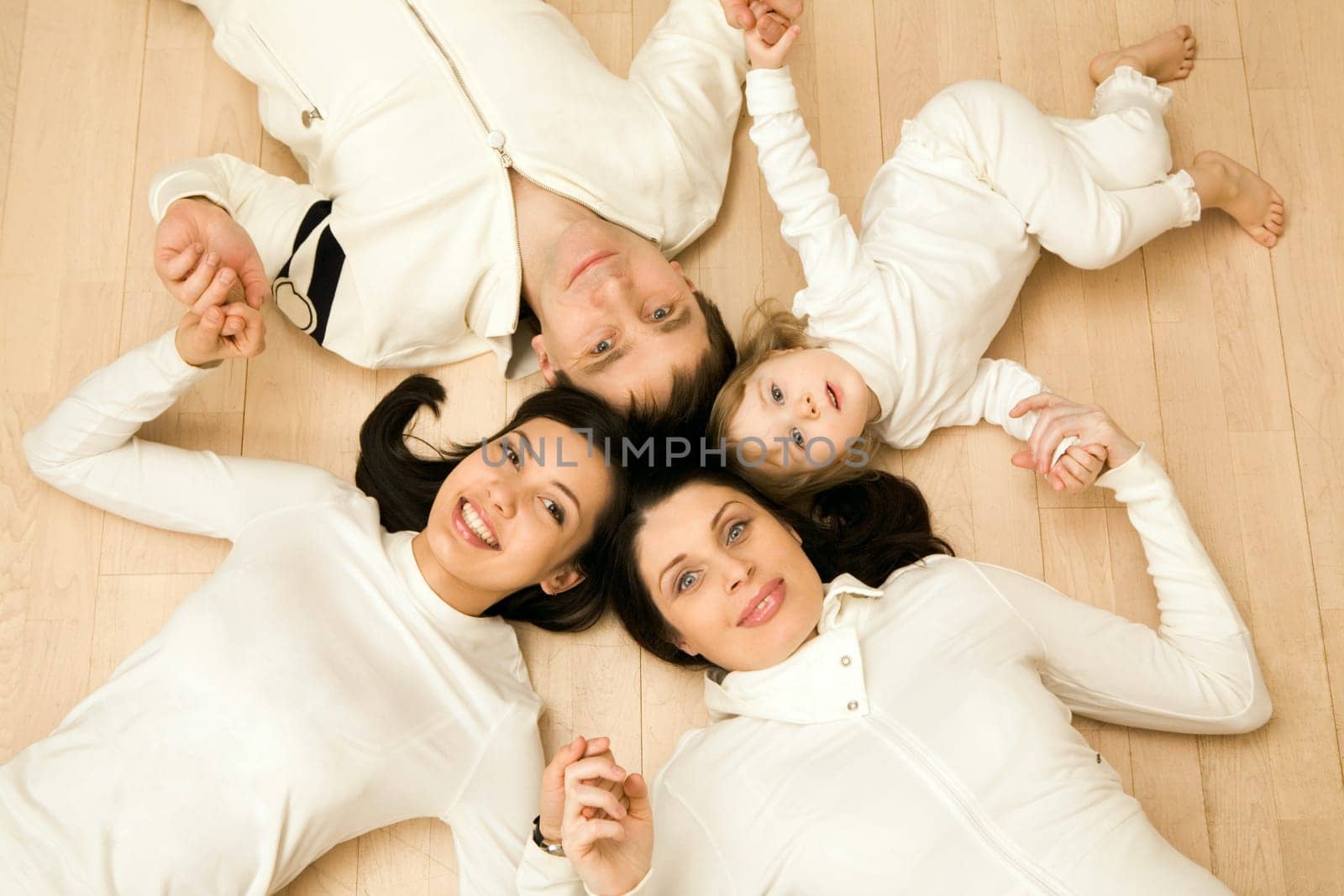 Above shot of Caucasian family consisting of father, mother, teenage and younger daughters