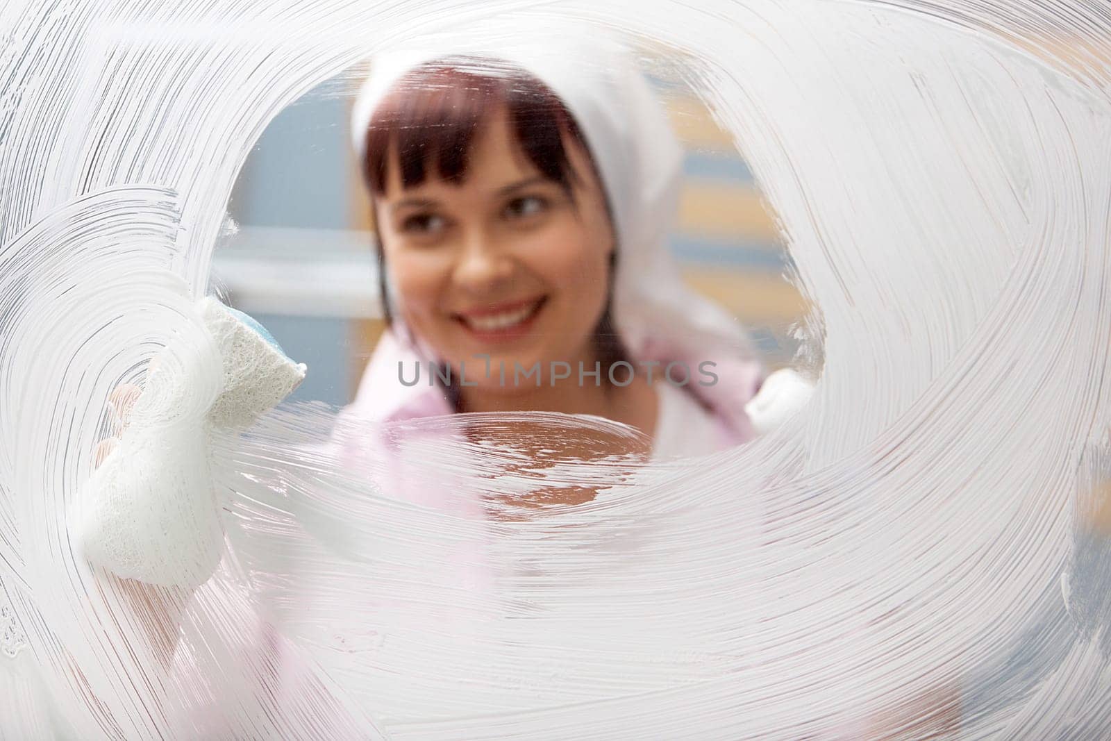 Portrait of a woman polishing glass