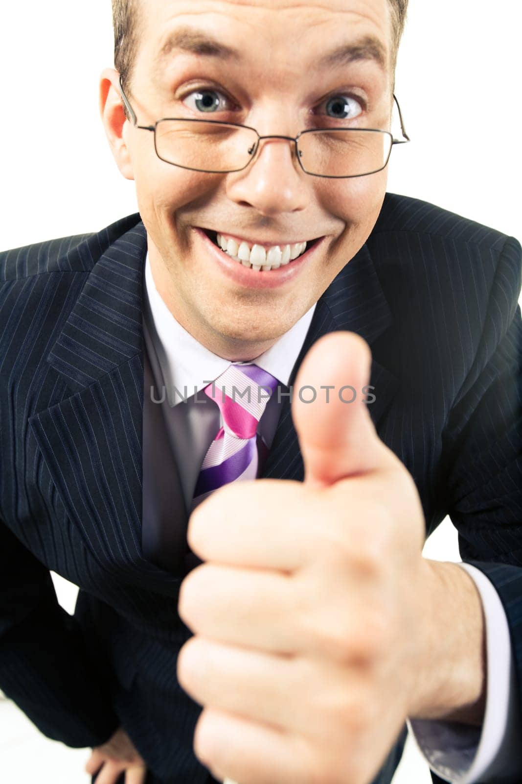 Close-up of happy businessman showing thumb up and looking at camera with smile