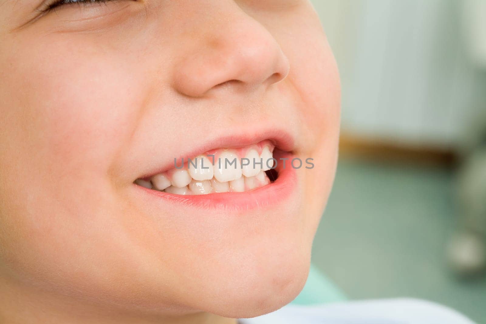 Close-up of little boy smiling at dentist office
