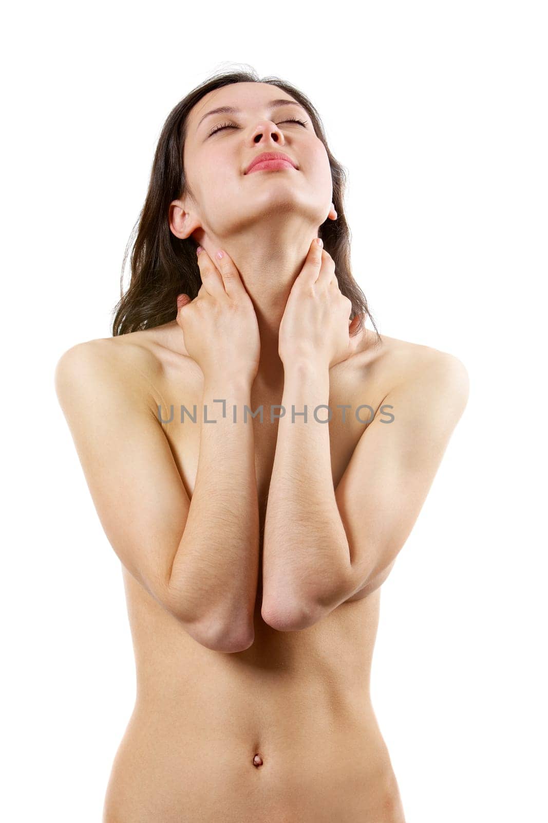 Portrait of calm female with her hands on neck taking pleasure
