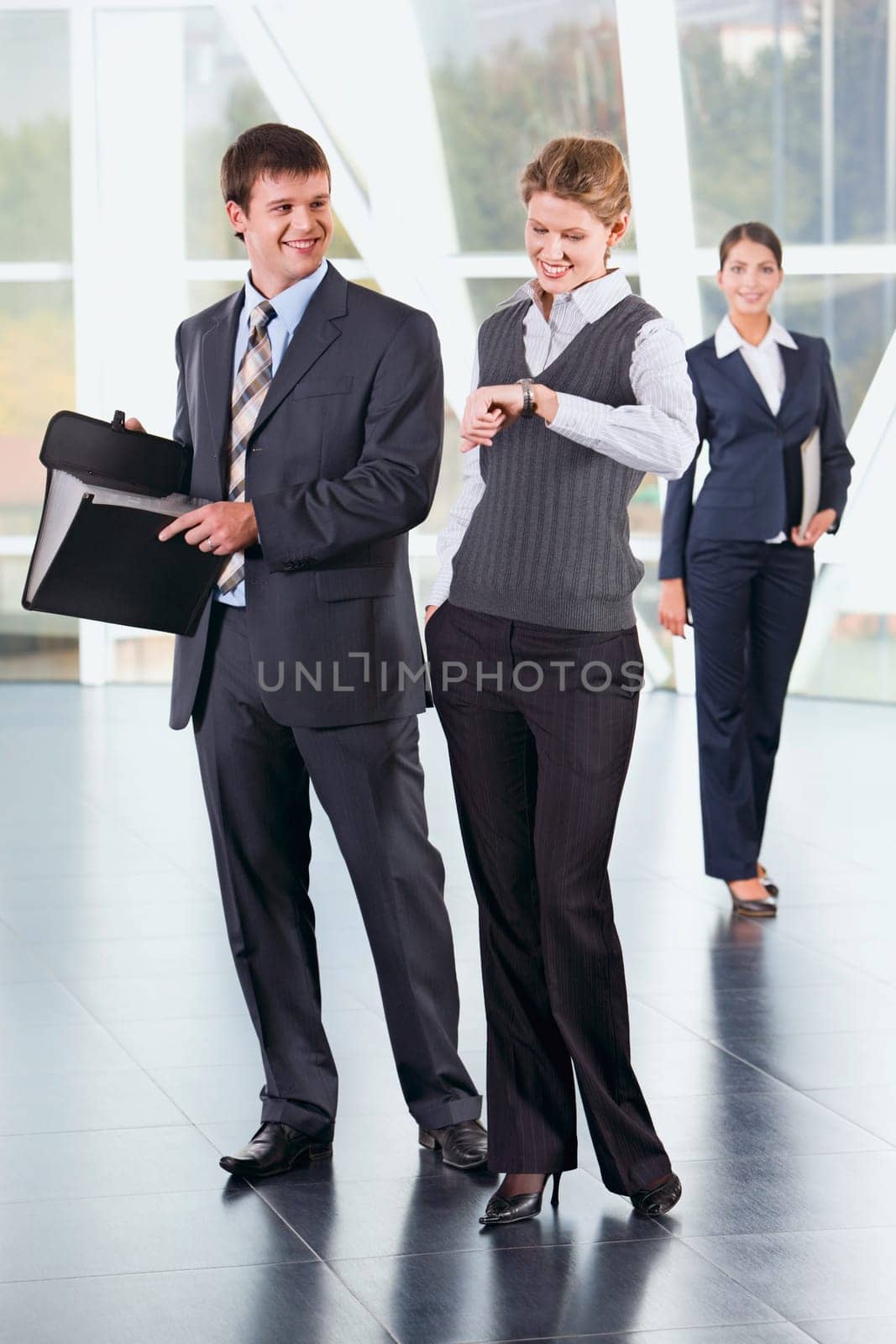 Portrait of young business people at meeting indoor