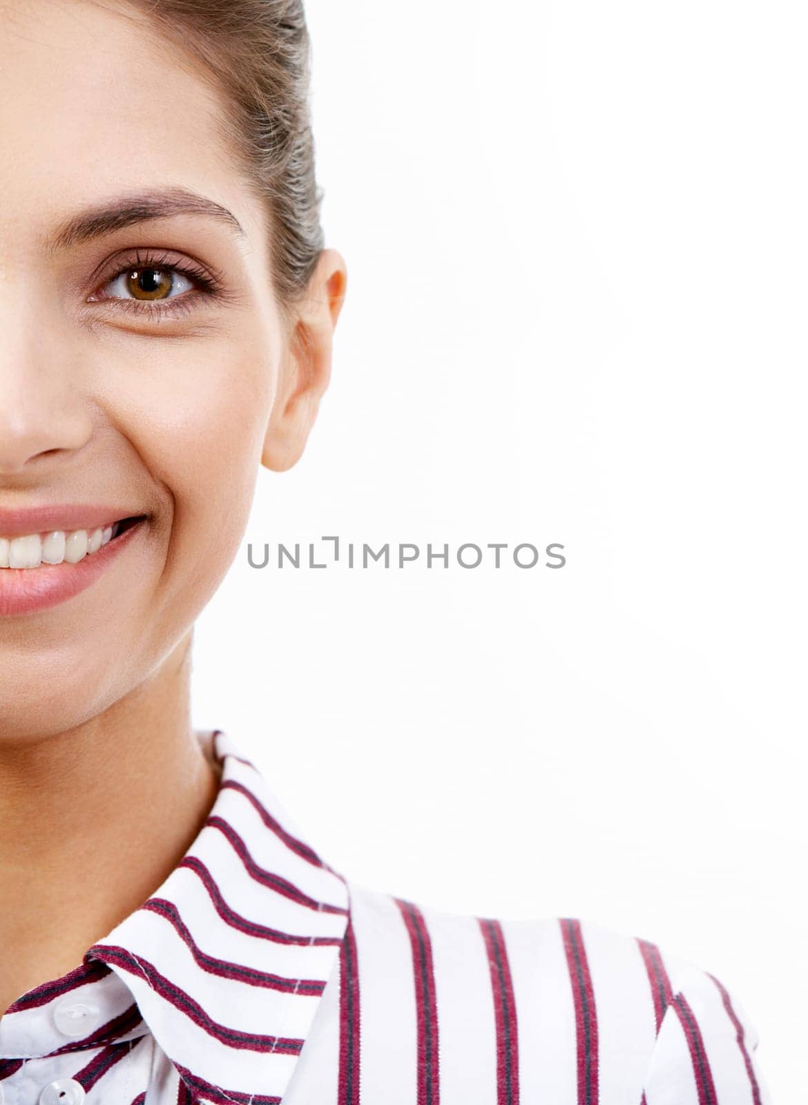 Half of face of smiling businesswoman looking at camera in isolation