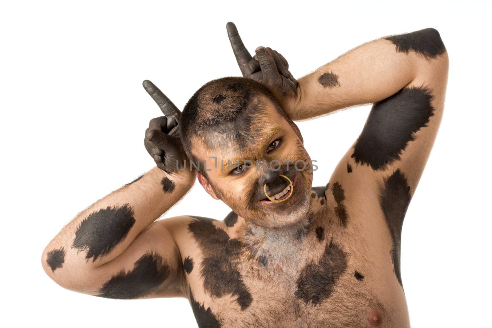 Portrait of man with body art looking at camera and smiling