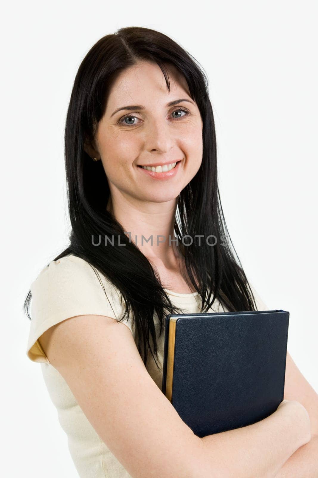 Portrait of pretty brunette looking at camera and smiling