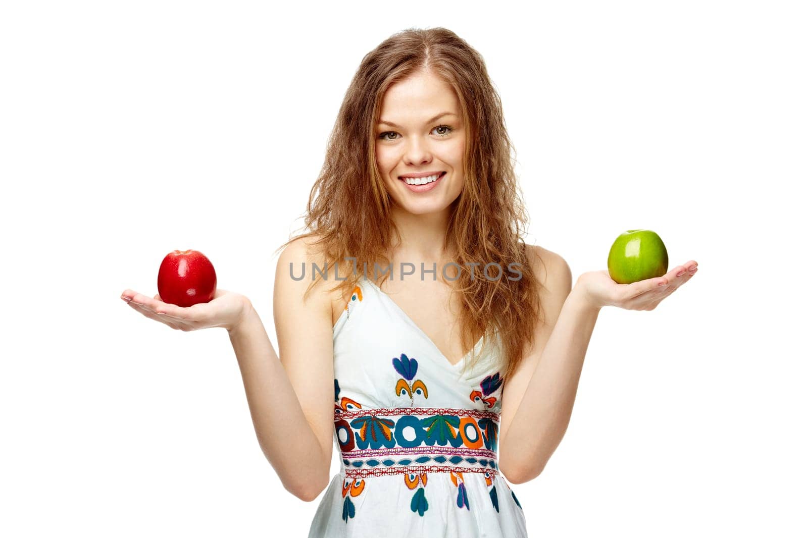 Portrait of a girl holding red and green apples
