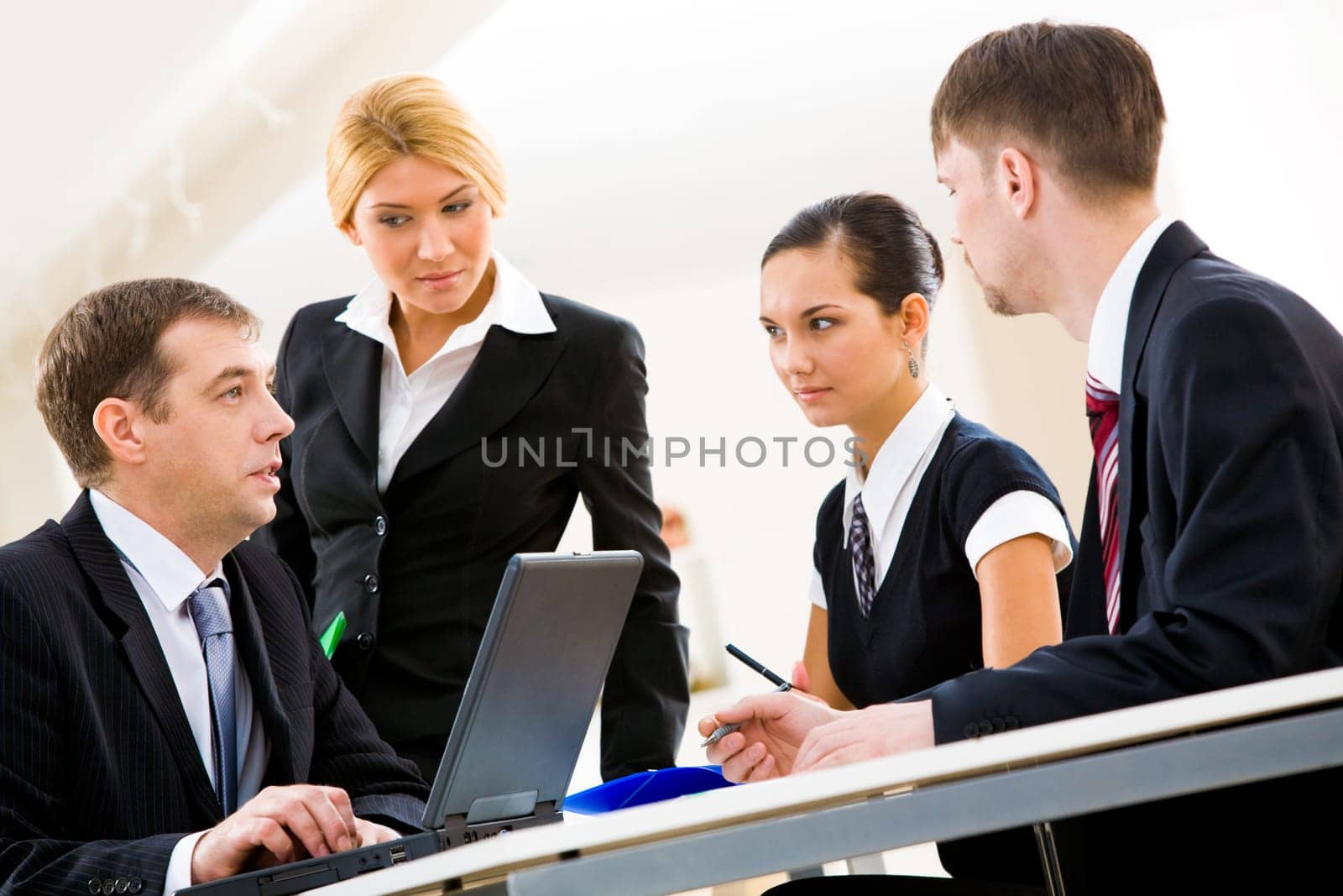 Portrait of serious people thinking of new idea and discussing it