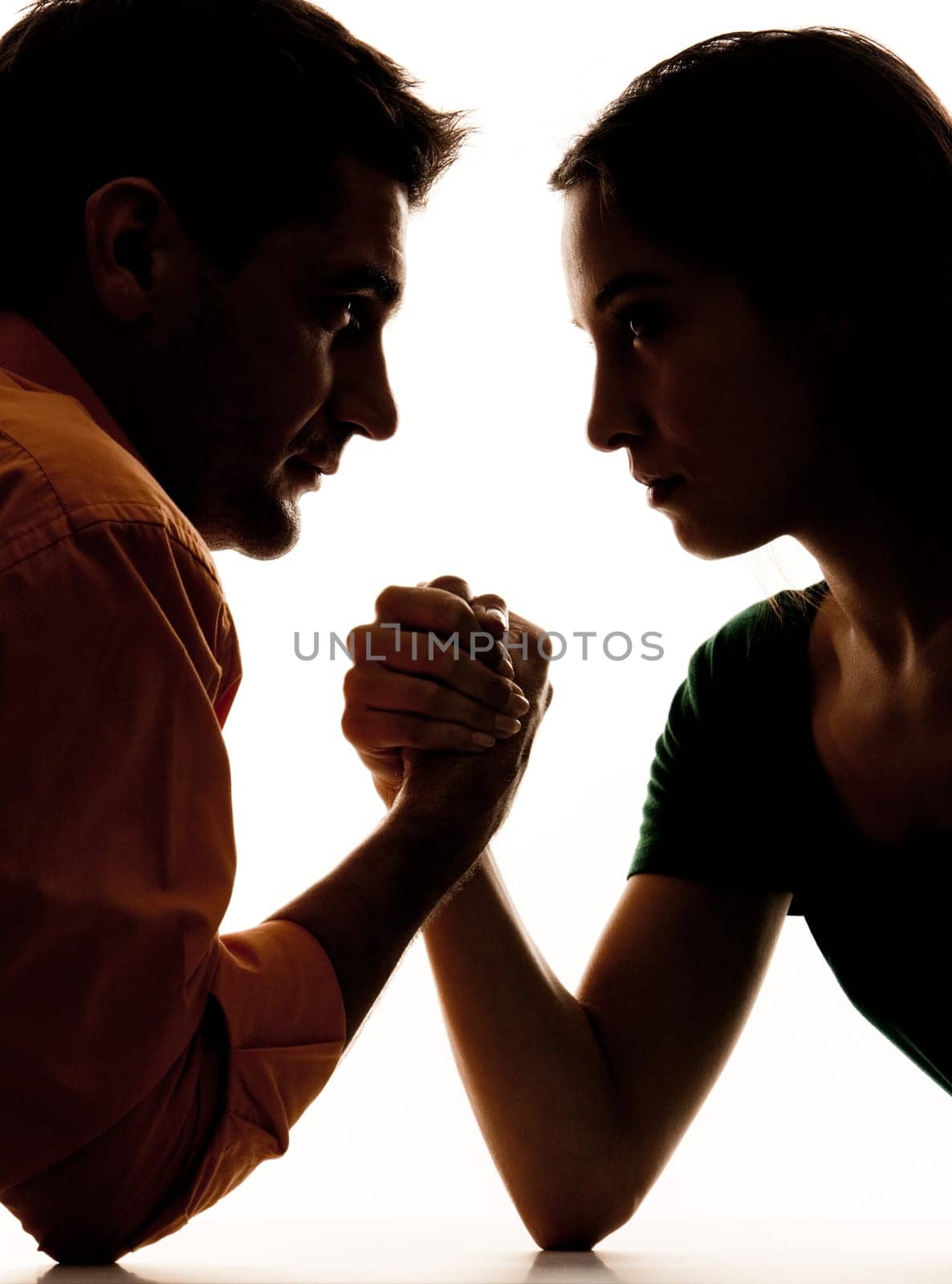 Close-up of dark figures of man and woman having struggle