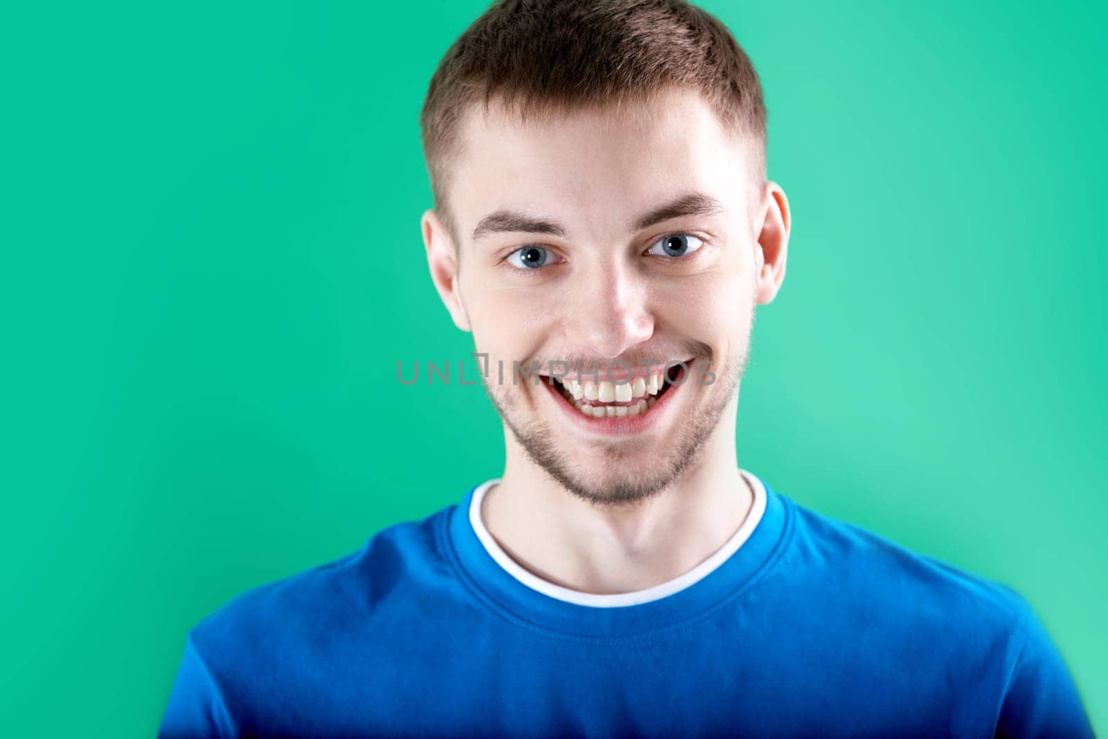 Portrait of young man looking at camera with smile