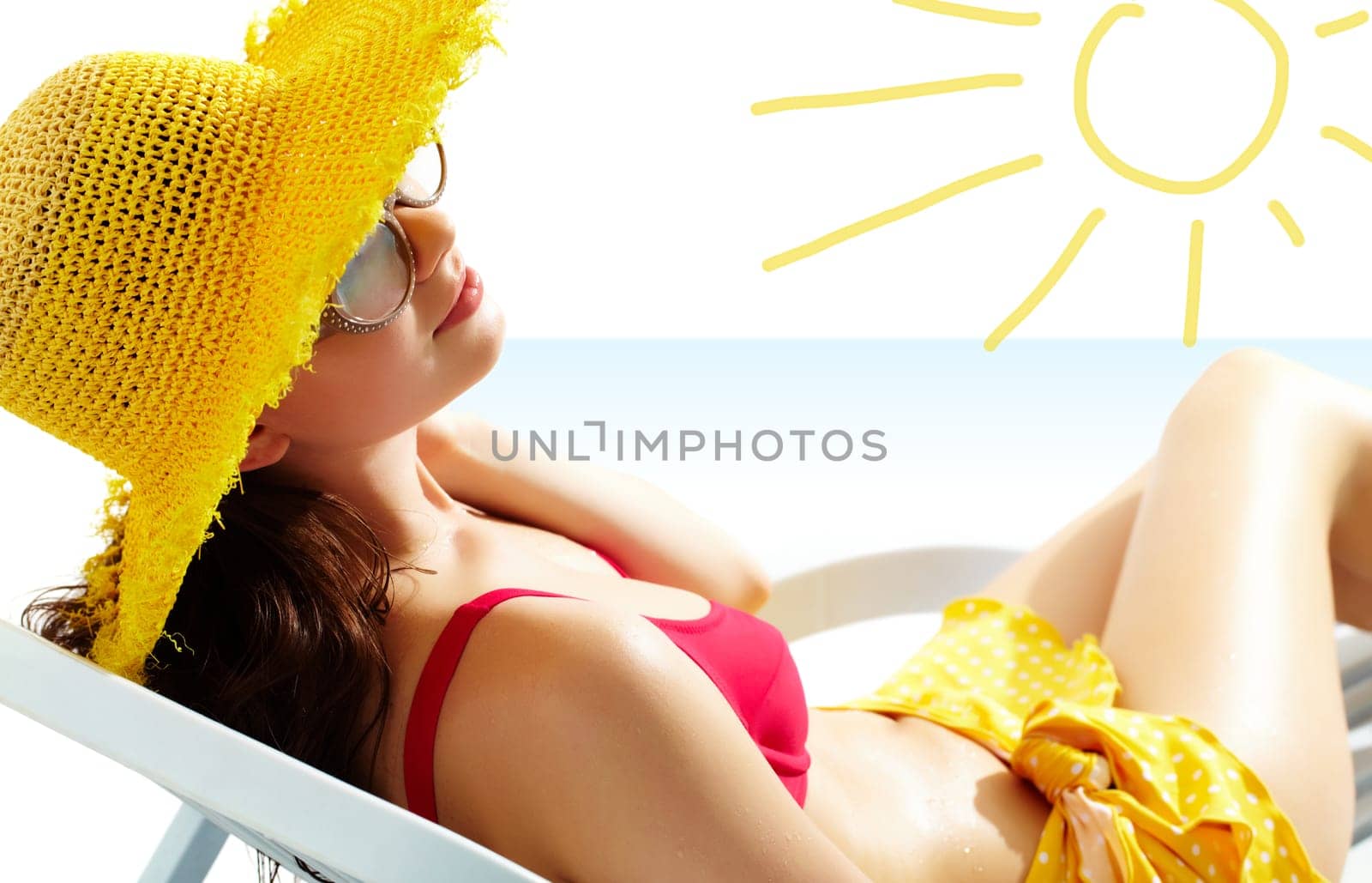 Portrait of a girl lying in the sun in chaise lounge
