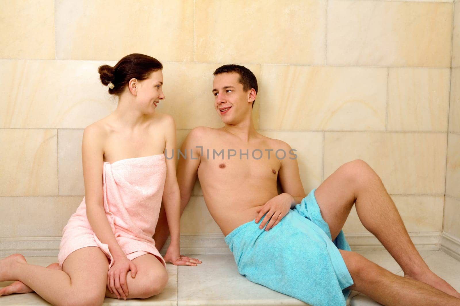 Image of happy couple resting after taking bath