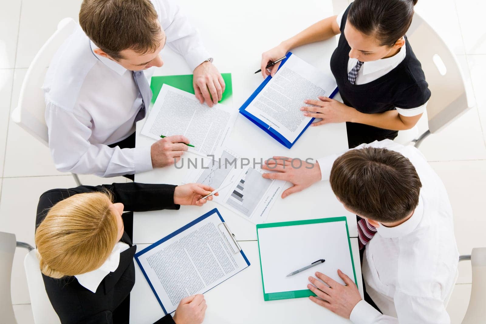 Above view of business team brainstorming while discussing new plans