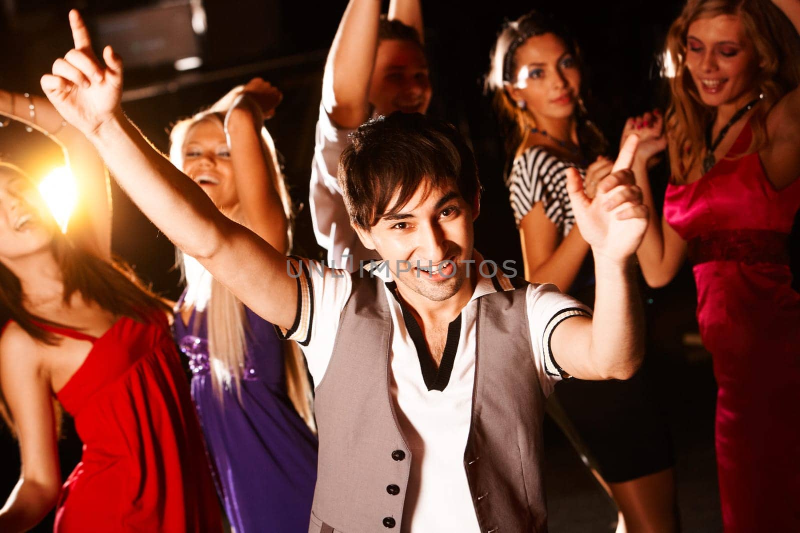 Portrait of energetic dancer on background of happy girls having fun