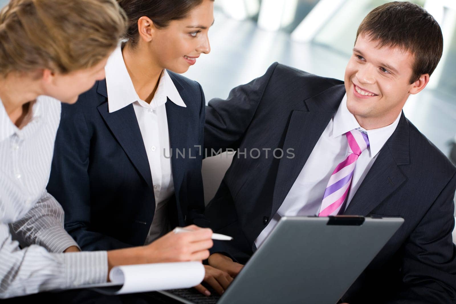 Portrait of three confident people discussing a new ideas
